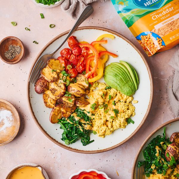 Hearty vegan breakfast bowl, complete with a Dairy-Free Cheddar Sauce using Follow Your Heart Dairy-Free Cheddar Shreds!