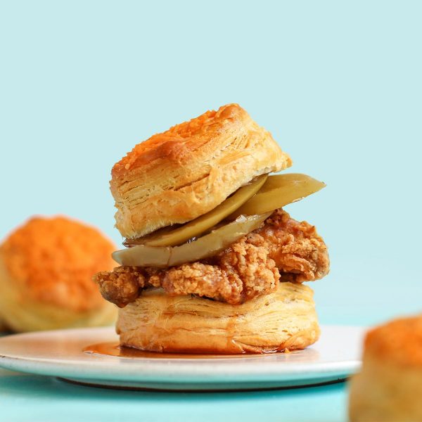 Cheddar Buttermilk Biscuits with Fried Chicken, Pickled Green Tomatoes, & Chipotle Hot ‘Honey’